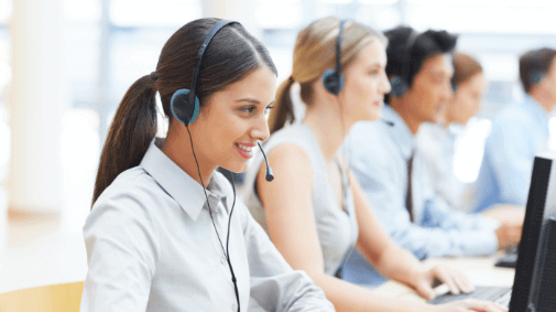 People wearing headsets in a call center